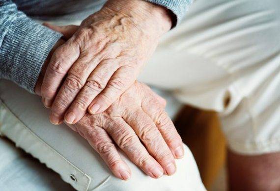 Adults holding hands