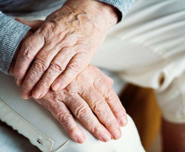 Adults holding hands